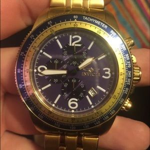 Round gold invicta tachymeter analog watch
